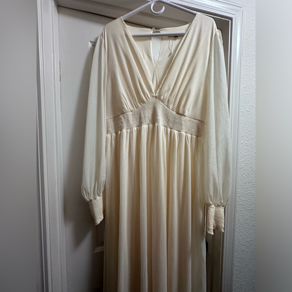 White floor length shimmer dress from Baltic Born.